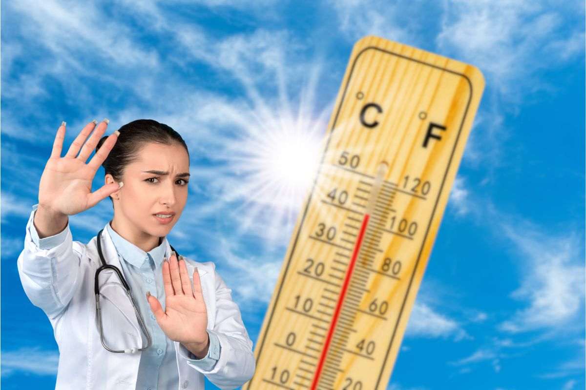 termometro estate e donna medico che fa stop con le mani