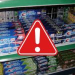 varie marche di dentifricio e segnale di pericolo
